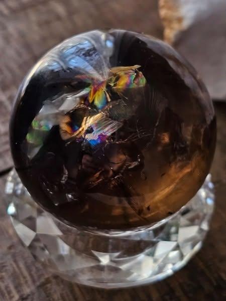 Raw smoky quartz crystal point with deep translucent brown facets for grounding energy